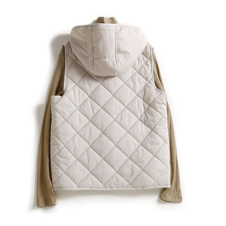 Women's hooded quilted vest, lightweight and chic. Sleeveless jacket for easy layering and casual style.