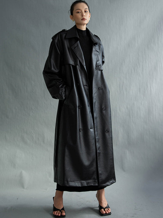 Chic women's long trench coat in classic beige, perfect for elegant fall and spring outerwear.