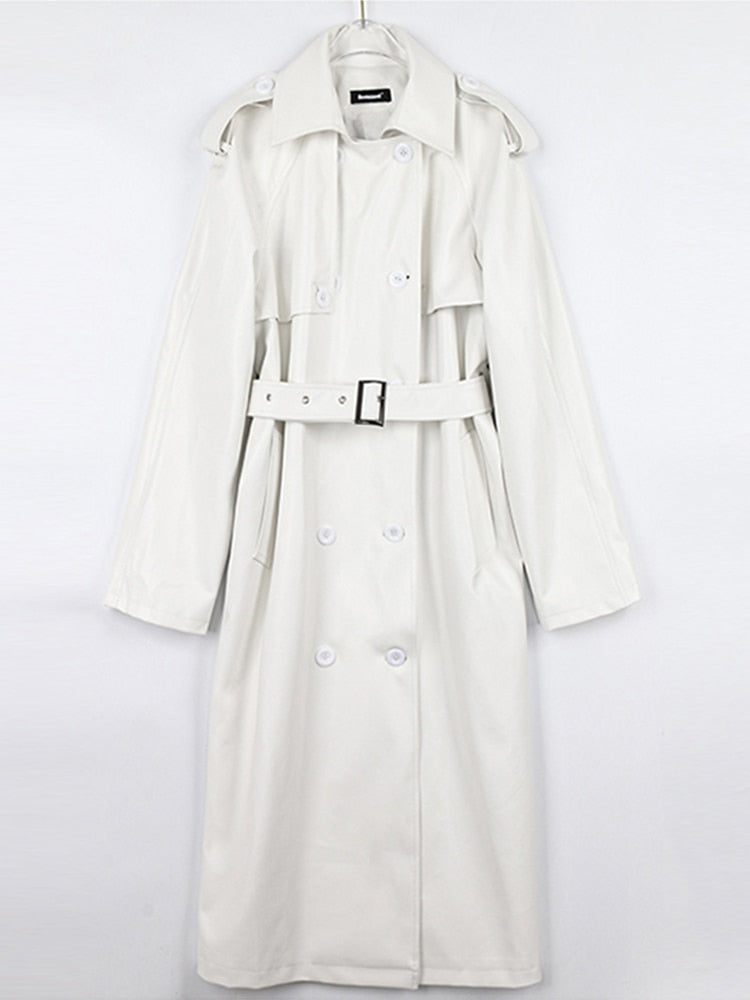 Women's chic long trench coat, crafted from quality fabric, a must-have for fall and spring fashion.