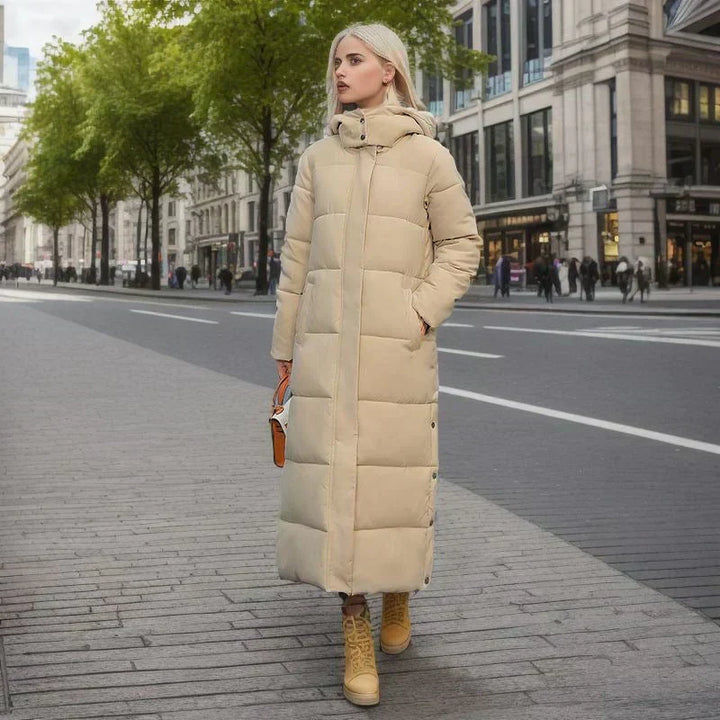 Elegant women's long coat with button closure, perfect for cold weather warmth.