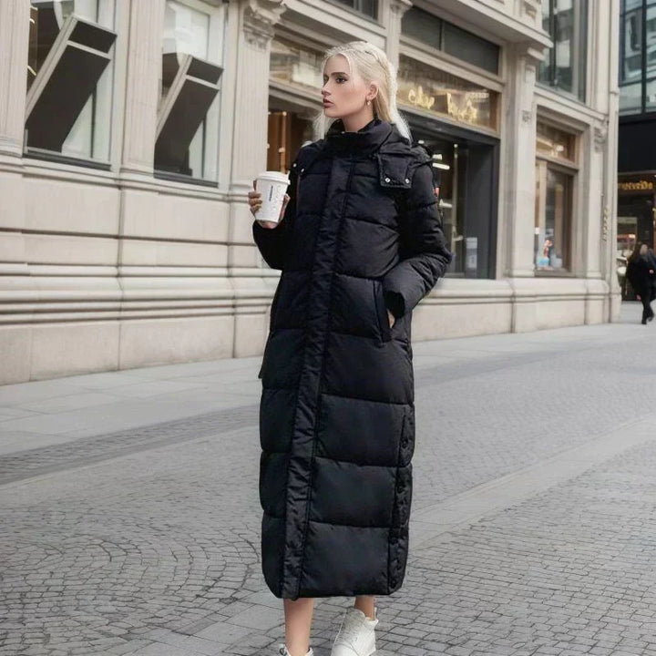 Woman wearing a chic long winter coat, demonstrating its elegant style and warmth.