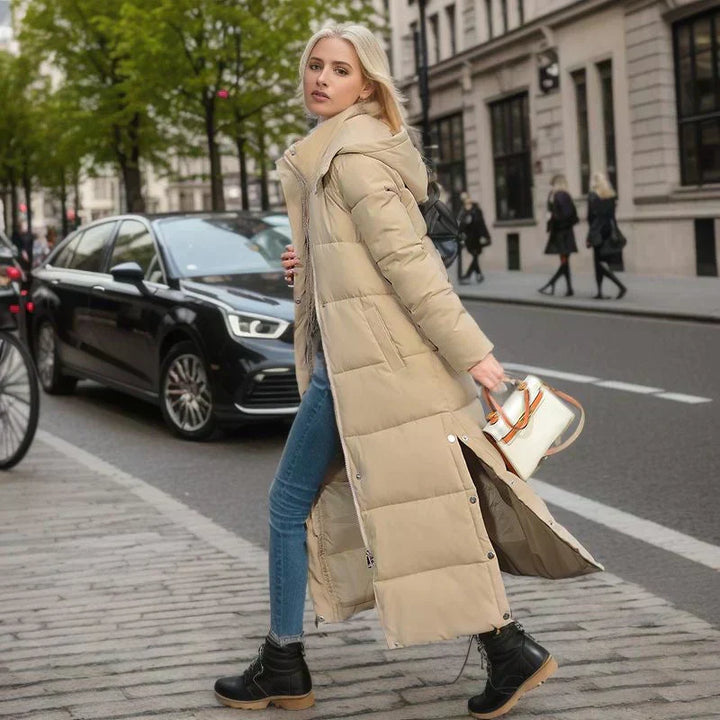 Grey chic women's long coat, elegant outerwear for cold weather protection.