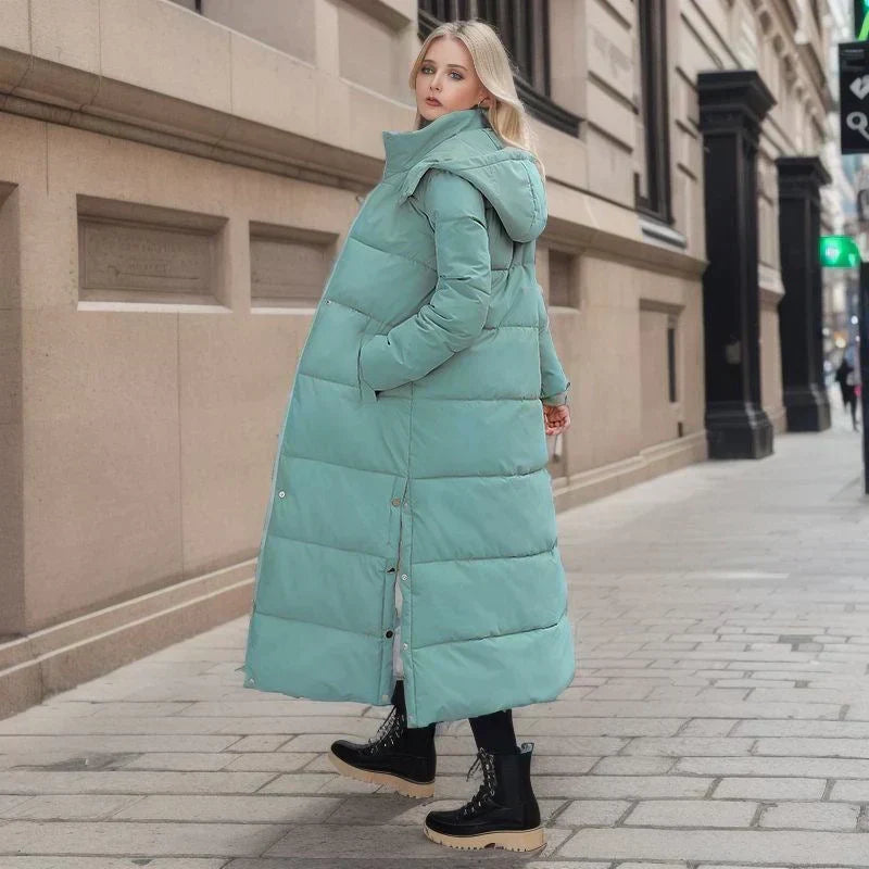 Seasonal outerwear: elegant women's long coat in navy for cold weather.