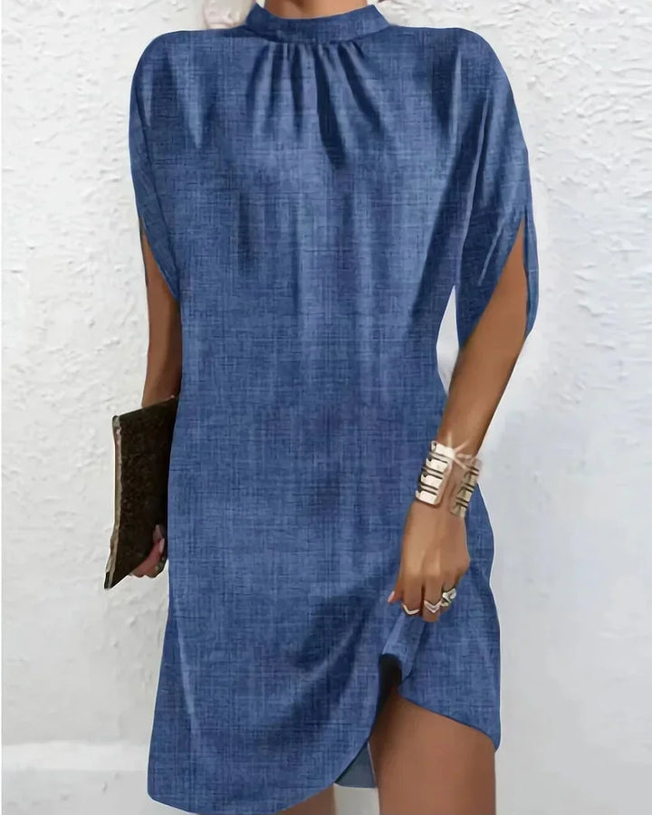 Chic women's mock neck mini dress with elegant cape sleeves, versatile for parties or casual wear.