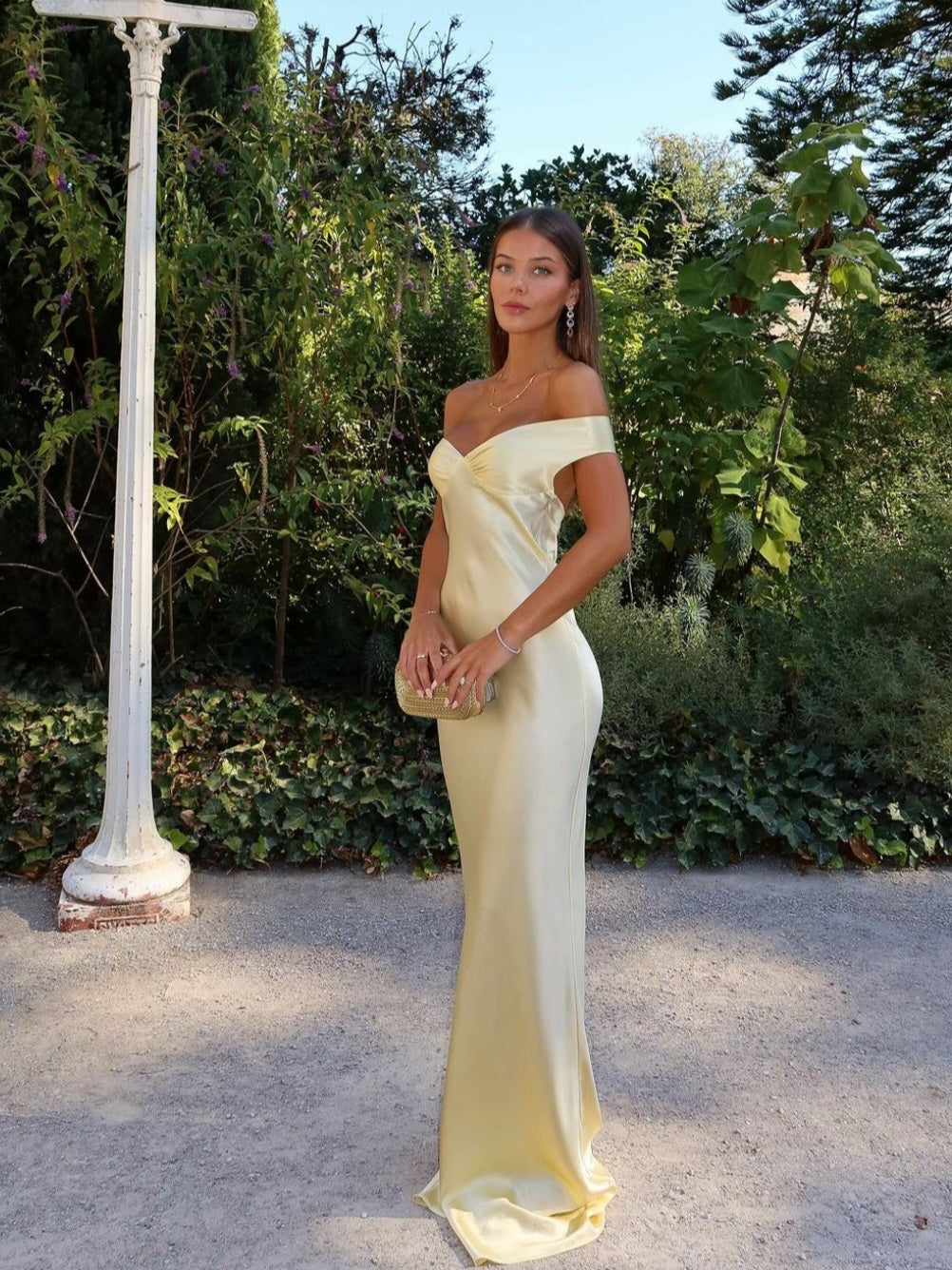 Chic women's off-shoulder maxi wedding guest dress. Elegant gold formal gown perfect for special occasions & parties.