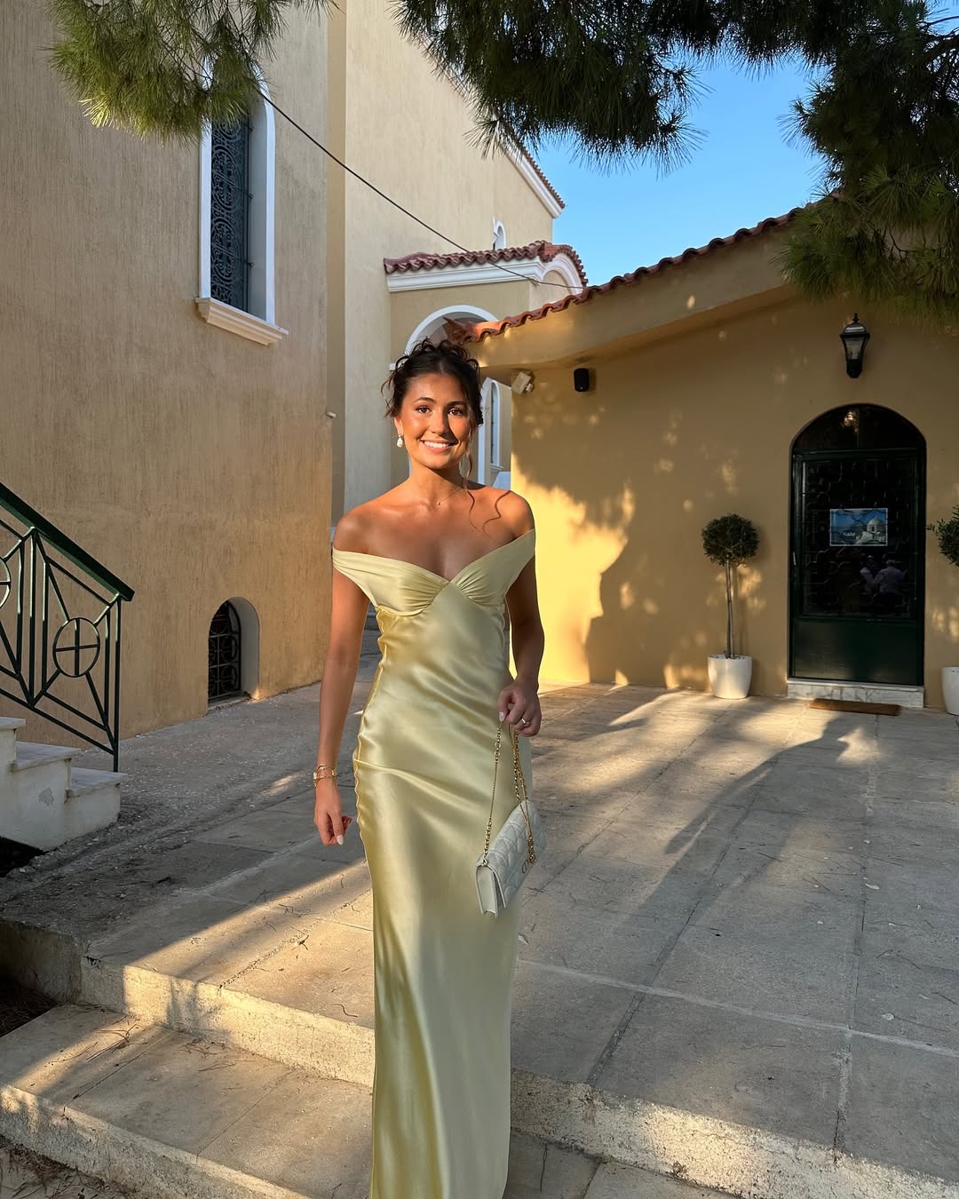 Women's chic gold off-shoulder long maxi dress. Elegant formal wedding guest gown, perfect for evening wear & special occasions.