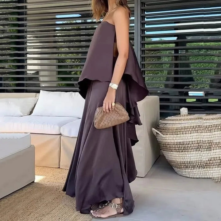 Stylish women's off-shoulder crop top and long maxi skirt two-piece clothing set for summer fashion.