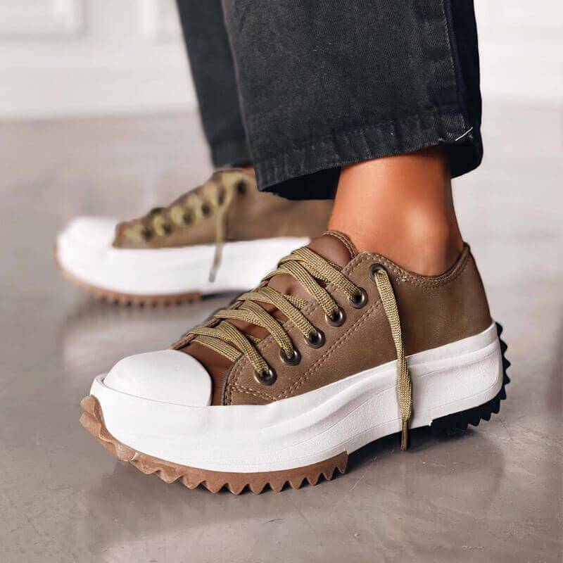 Stylish women's platform sneakers, adding height and modern chic to any outfit.
