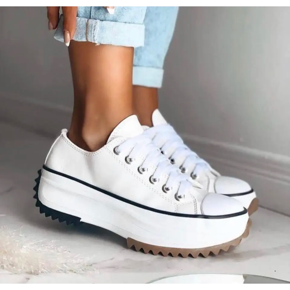 Fashionable women's platform sneakers, offering comfort and a sleek, elevated design.