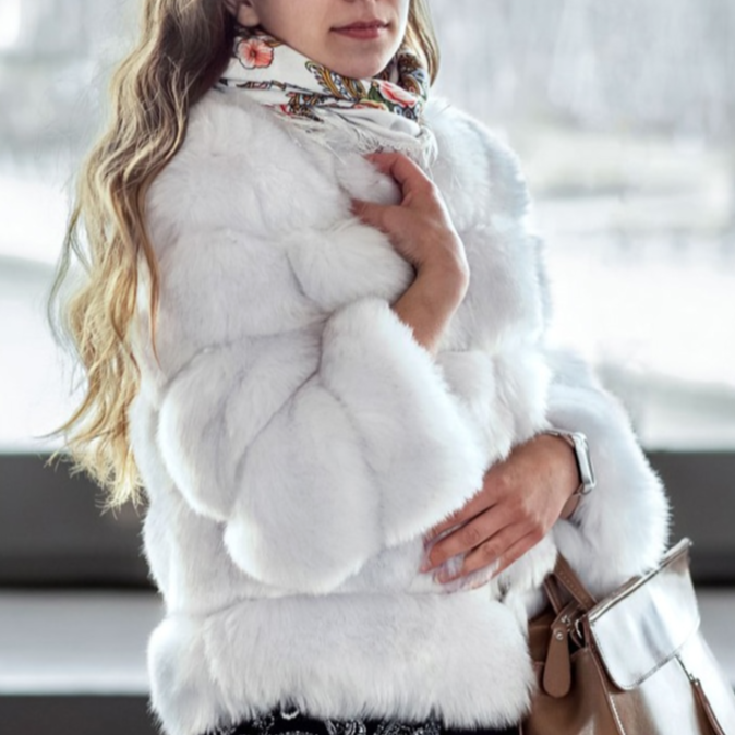 Soft women's plush winter coat, offering ultimate coziness. Warm and stylish cold weather outerwear.