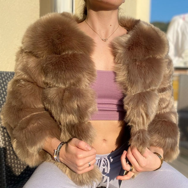 Cozy women's plush jacket, a warm layering piece for winter. Chic and fashionable outerwear.