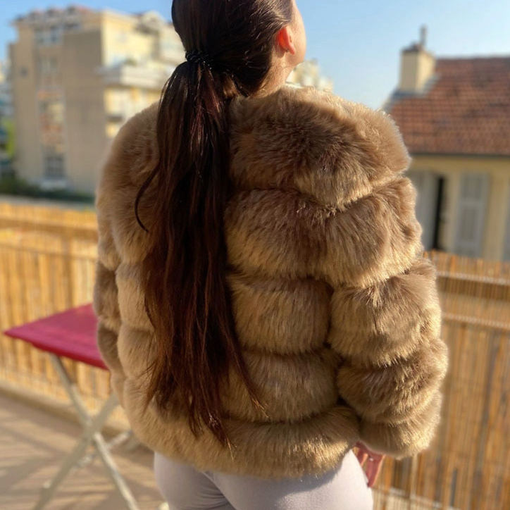 Warm women's plush winter outerwear, blending chic style with cozy comfort for cold days.