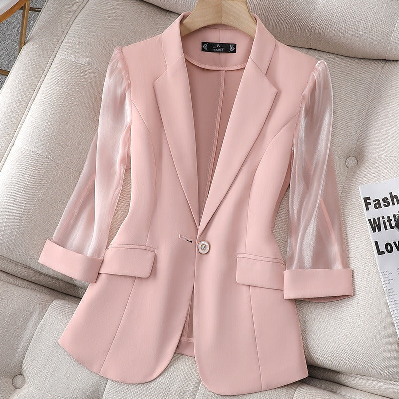 Black women's tailored blazer with stylish sheer sleeves. Ideal for business attire, office wear & elegant power dressing.