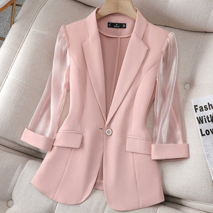 Black women's tailored blazer with stylish sheer sleeves. Ideal for business attire, office wear & elegant power dressing.
