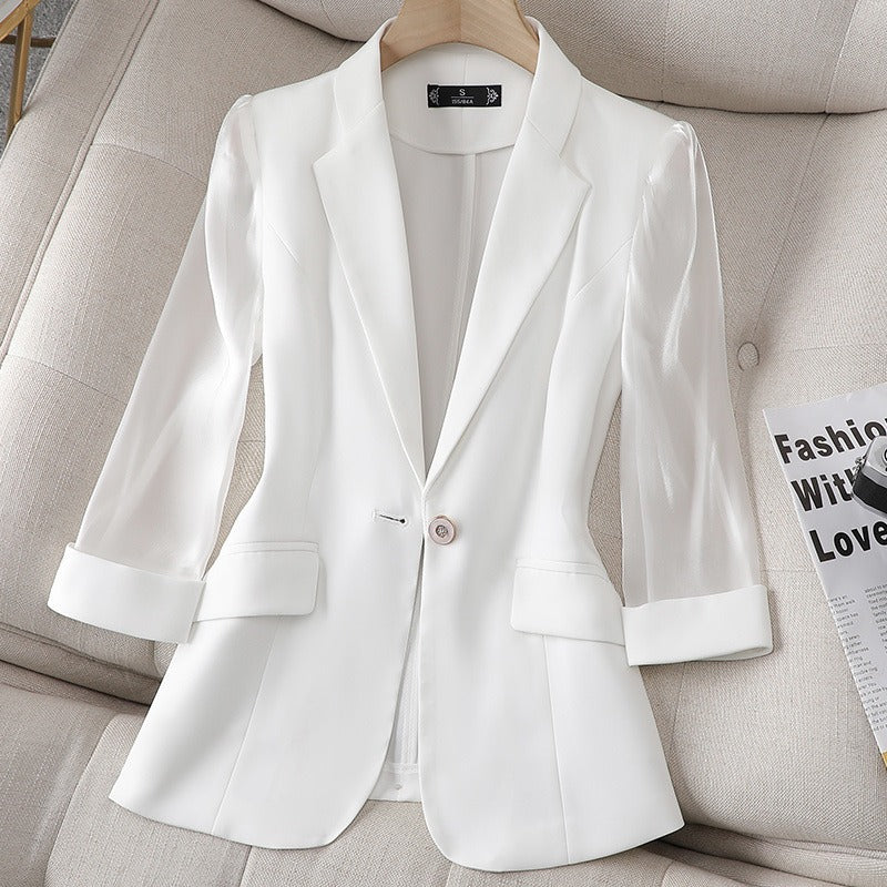 Pink women's chic blazer featuring sheer sleeves. A versatile tailored jacket for modern professional & elegant office wear.
