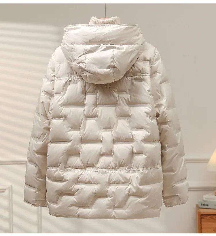 Elegant women's quilted puffer jacket with a warm, durable design for chilly winter days.