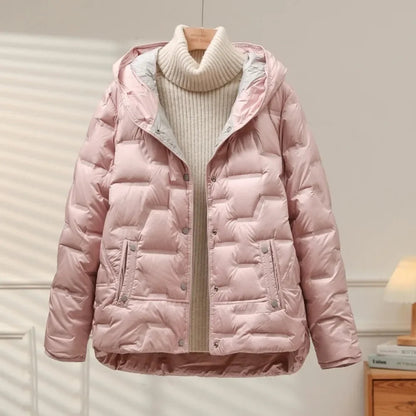 Fashionable women's puffer jacket, ideal for layering and staying warm in cold weather.
