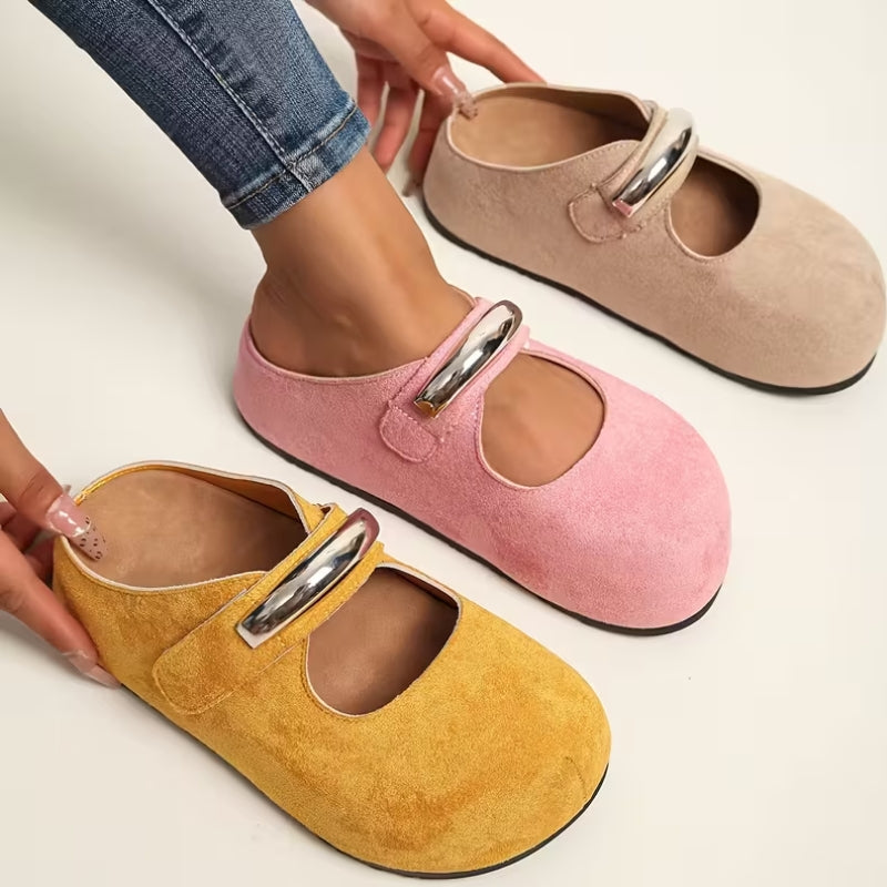 Comfortable chic women's suede loafers with subtle metallic accent, versatile for any casual outfit.