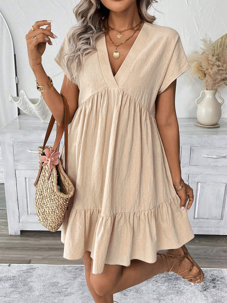 Stylish women's sleeveless V-neck summer mini dress with a trendy ruffle hem, offering a chic and comfortable look.