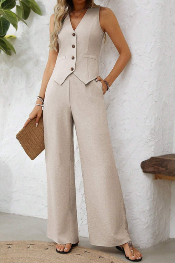 Elegant women's tailored vest and wide-leg trousers ensemble, versatile for professional or smart casual looks.