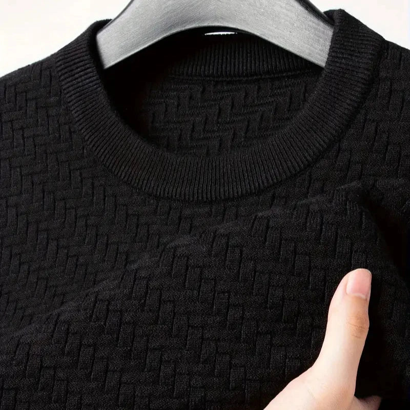 Elegant women's textured knit sweater for winter wear, a cozy long sleeve top with a relaxed, chic fit.