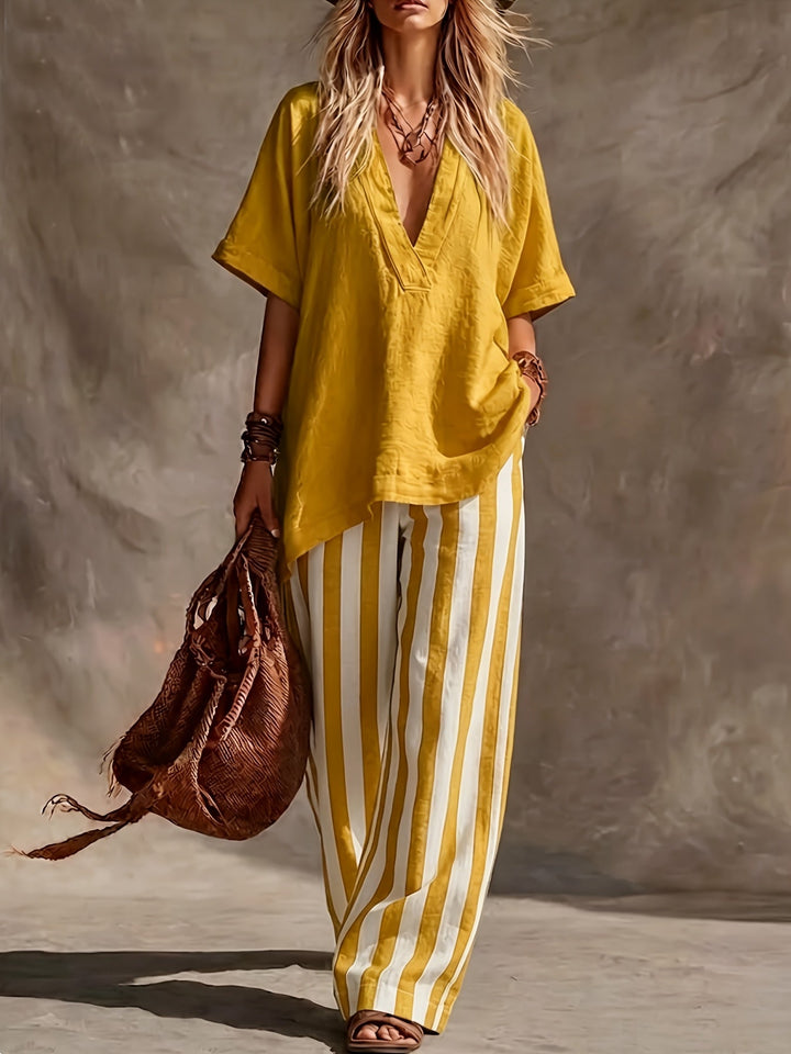 Stylish matching set for women: V-neck short sleeve top and comfortable striped wide-leg pants. Ideal for resort wear.