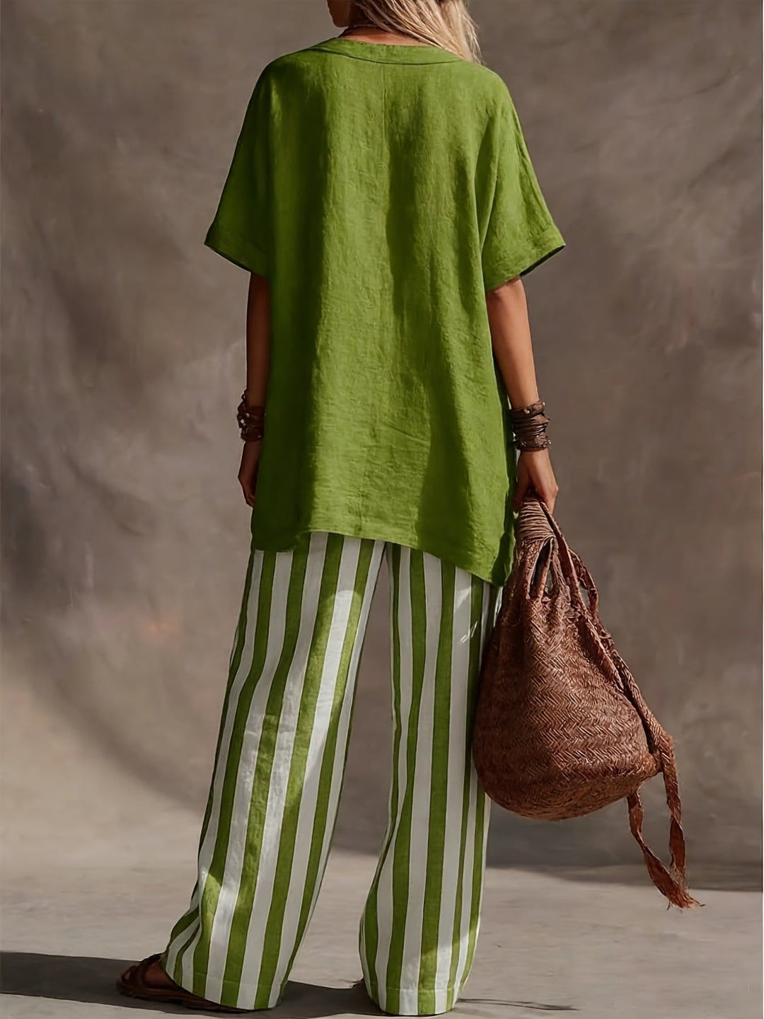 Casual women's fashion: Two-piece set with a V-neck top & striped wide-leg pants. Great for everyday comfort.