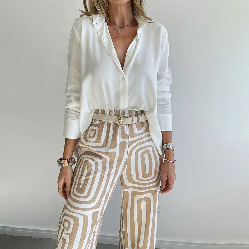 Versatile women's flowing top & patterned trouser set, ideal for elegant day wear or chic evening outfits.