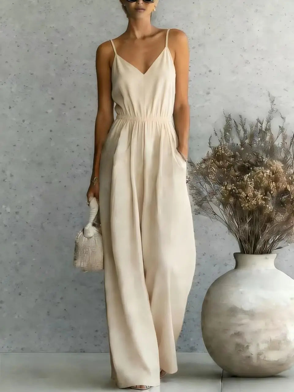 Effortless women's V-neck wide leg casual jumpsuit. A comfortable, chic one-piece for summer or vacation wear.