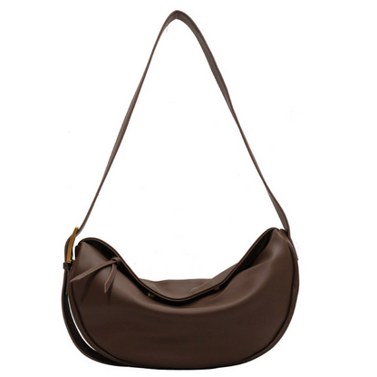 Chic women's vegan leather crossbody handbag with an adjustable strap, perfect for everyday style.