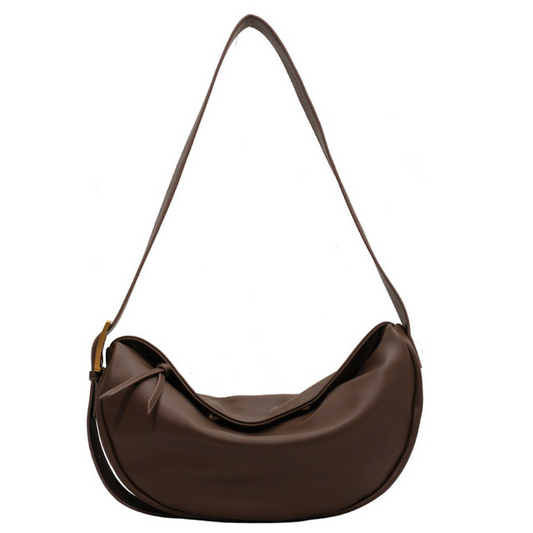 Chic women's vegan leather crossbody handbag with an adjustable strap, perfect for everyday style.
