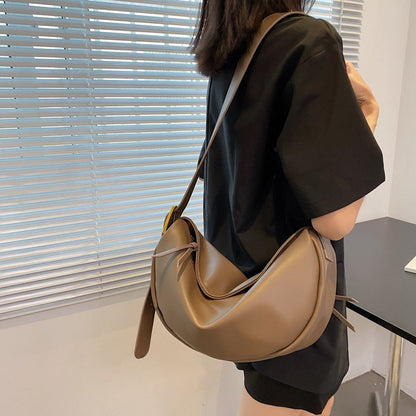 Versatile chic women's shoulder bag, made of soft vegan leather, with an adjustable crossbody strap.