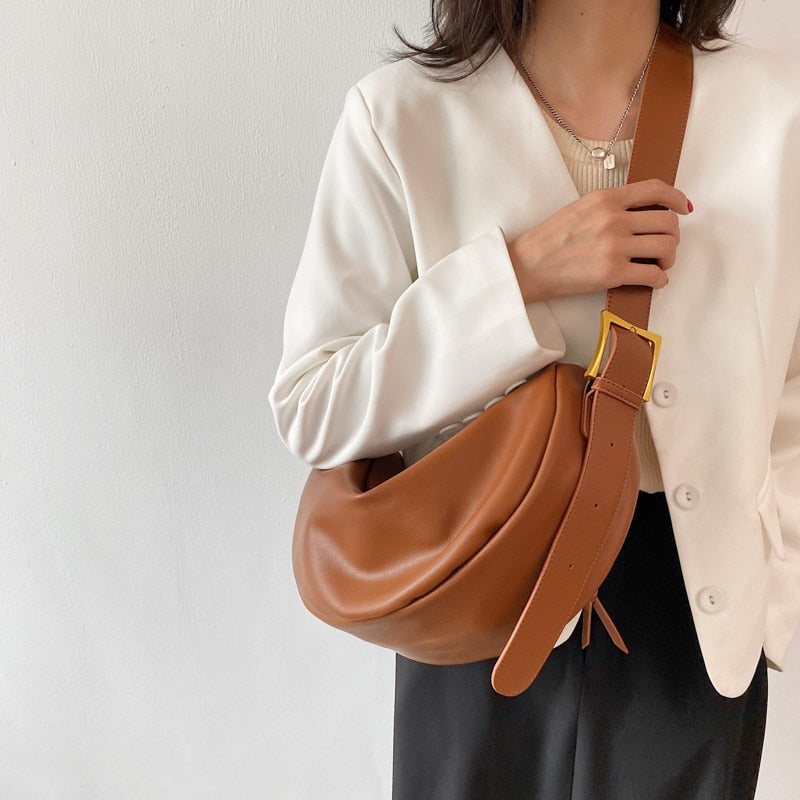 Modern women's vegan leather crossbody handbag, a sleek and stylish everyday accessory.