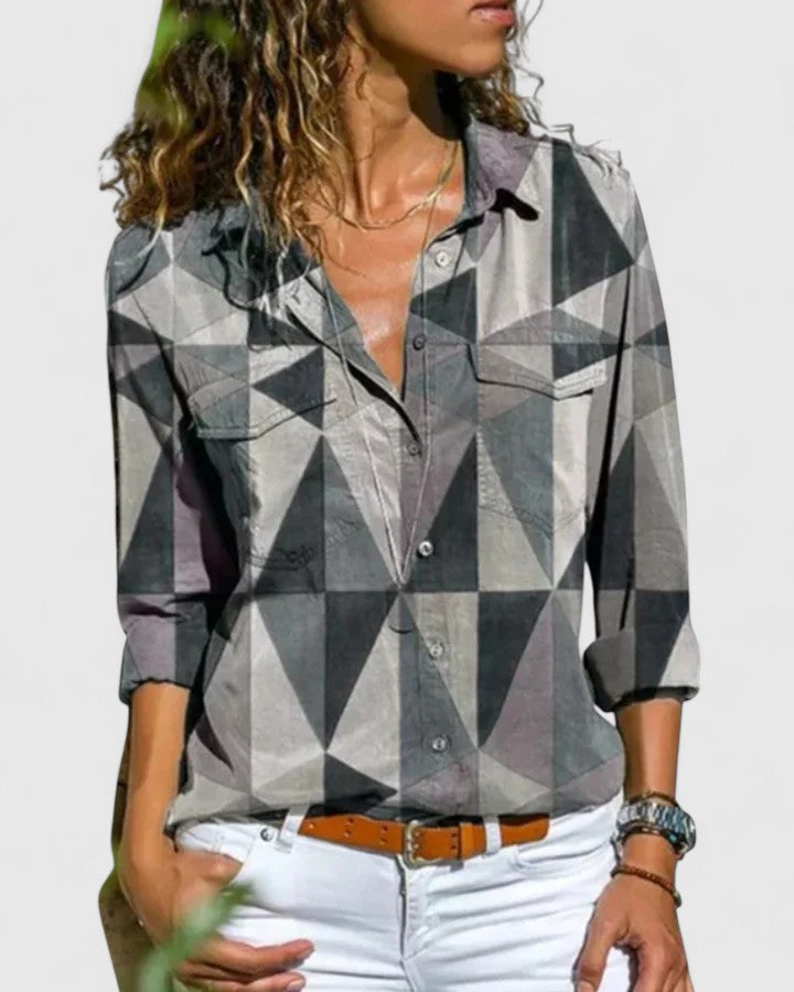 Elegant women's short sleeve blouse. This chic, lightweight top offers a comfortable fit for any summer occasion.