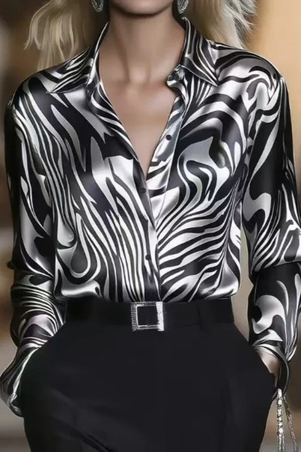 Sophisticated women's black and coffee zebra print blouse, a long sleeve button-down with stylish liquid sheen.