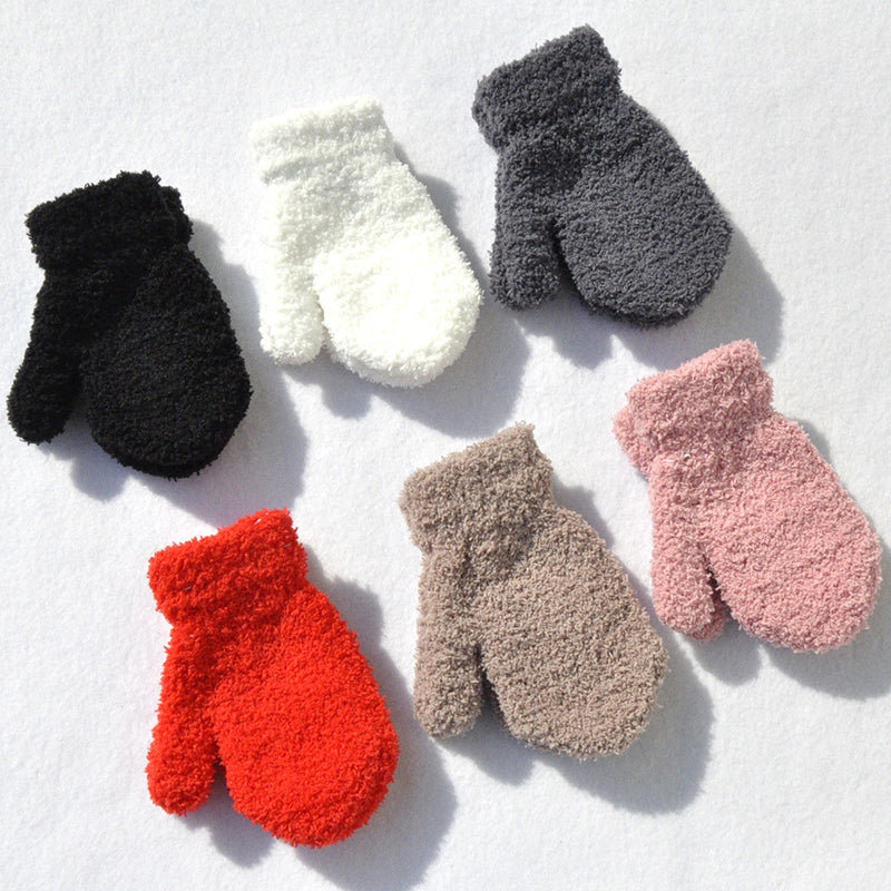 Children's winter mittens with thick plush fleece. Perfect warm gloves for cold weather outdoor play.