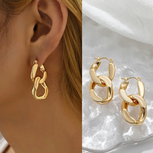 Chunky gold link drop earrings for women, a bold fashion statement accessory.