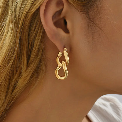 Stylish women's chunky gold link drop earrings, perfect for modern jewelry trends.