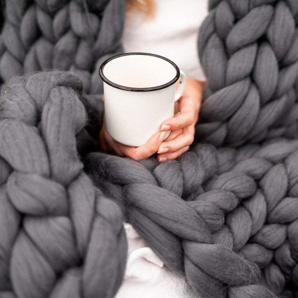 Oversized chunky wool yarn for knitting luxurious, soft blankets. Ideal DIY craft supply.