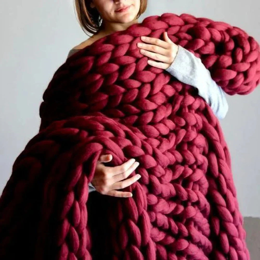 Knitting chunky wool yarn for extra soft blankets. Perfect craft supply for cozy home decor.