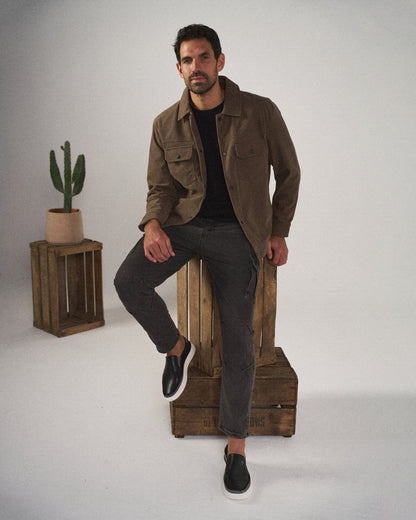 Versatile men's black leather slip-on shoes, great for everyday casual outfits & comfort.