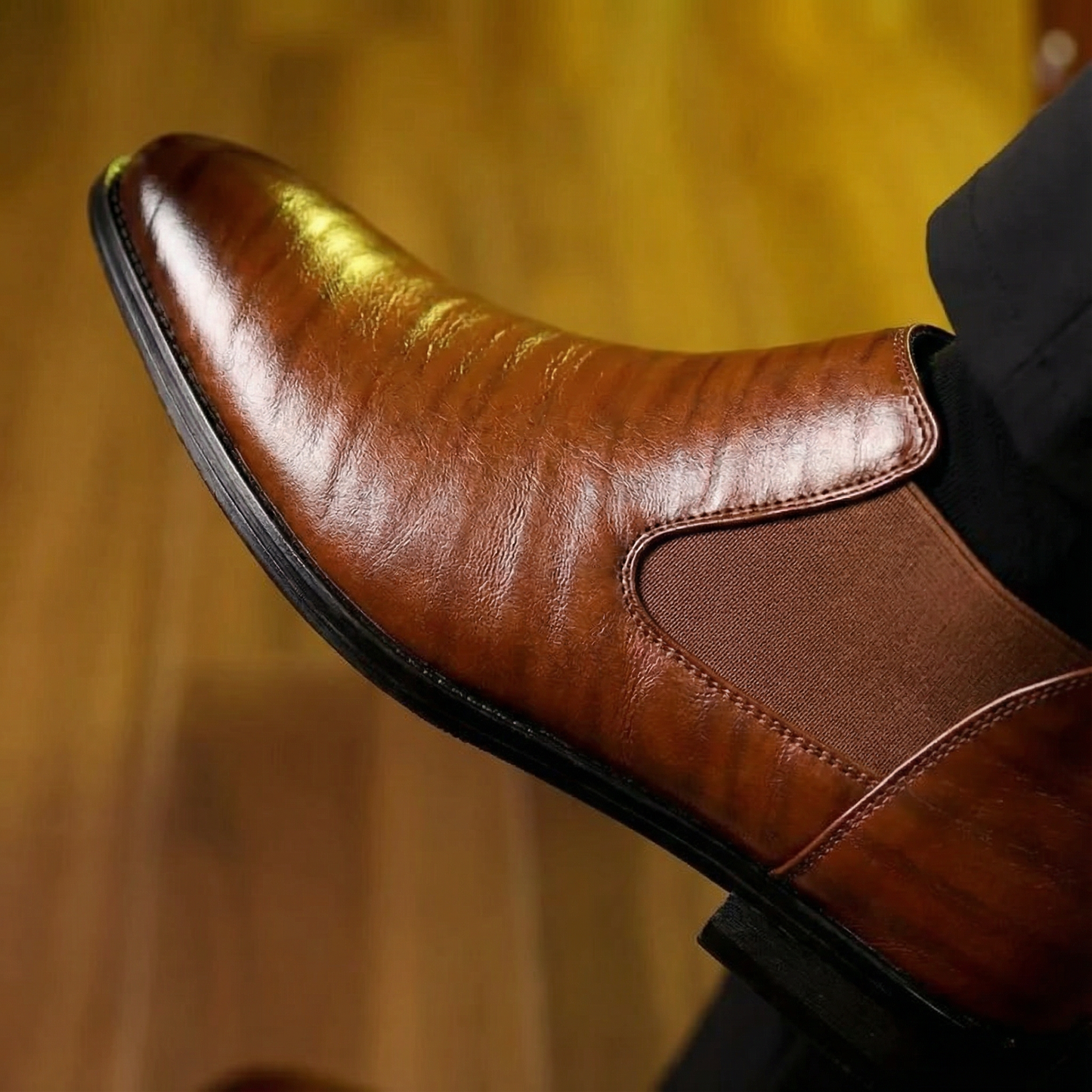 Versatile men's leather Chelsea boots in a rich oxblood color, great for dress or casual wear.