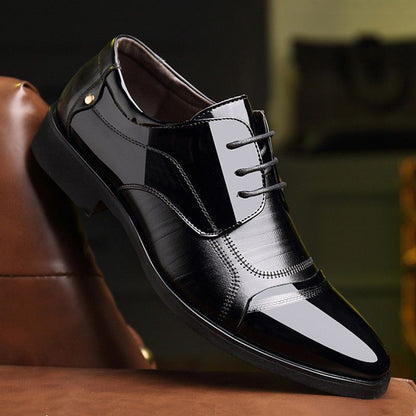 Detailed shot of men's black Oxford dress shoes, highlighting the elegant lace-up design.