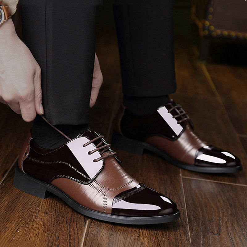 Polished black Oxford lace-up shoes, a classic style for men's formal dress.