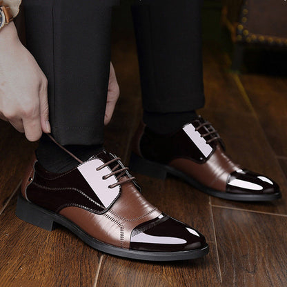 Polished black Oxford lace-up shoes, a classic style for men's formal dress.