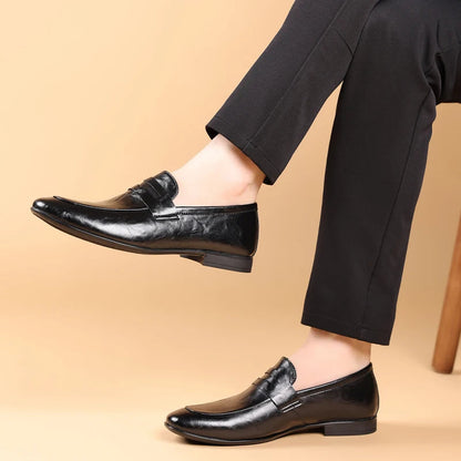 Men's polished black leather loafers, easy slip-on design for professional and business casual wear.