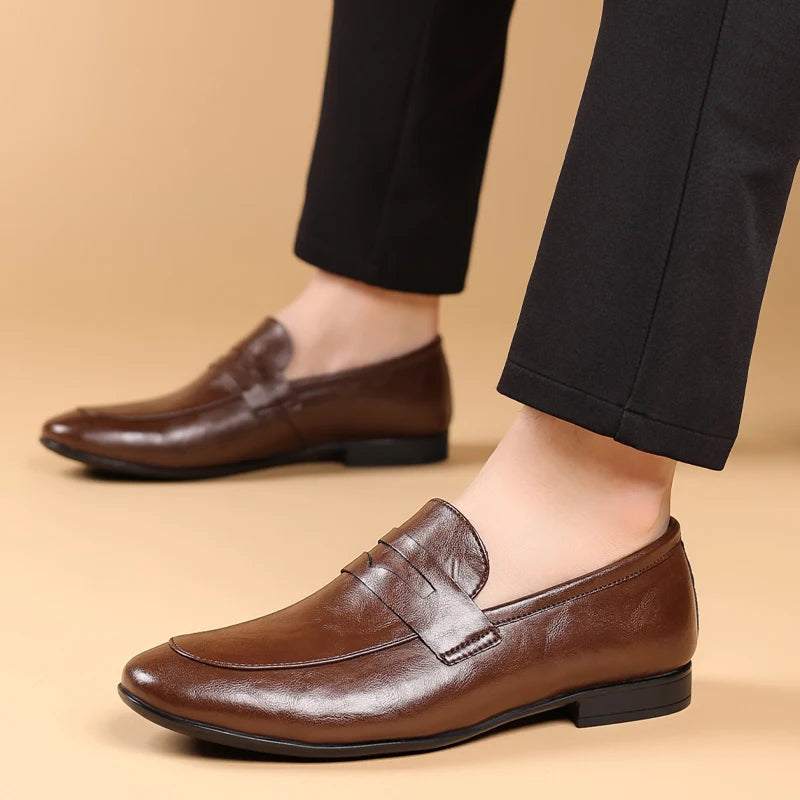 Elegant men's black leather slip-on shoes, versatile dress loafers for formal and office settings.