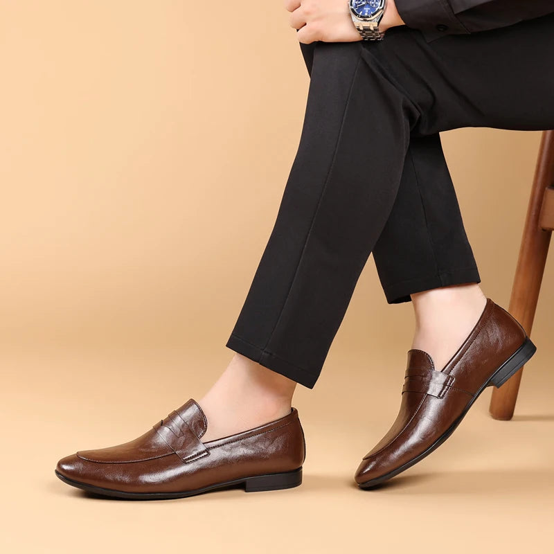 Professional men's classic black leather loafers, comfortable and polished slip-on dress shoes.
