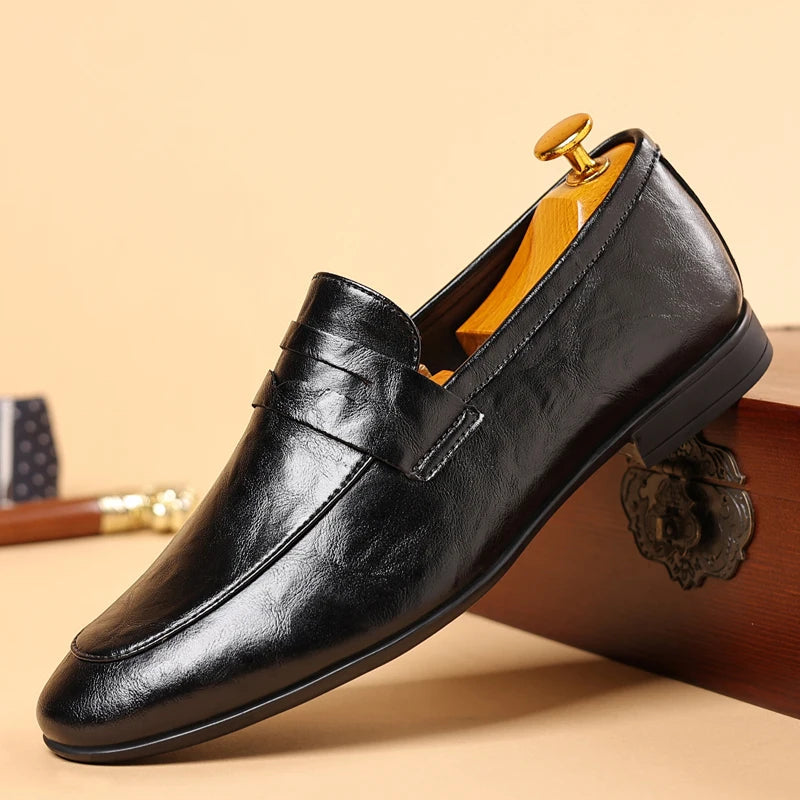 Classic men's brown leather loafers, slip-on style, perfect for sophisticated business looks.