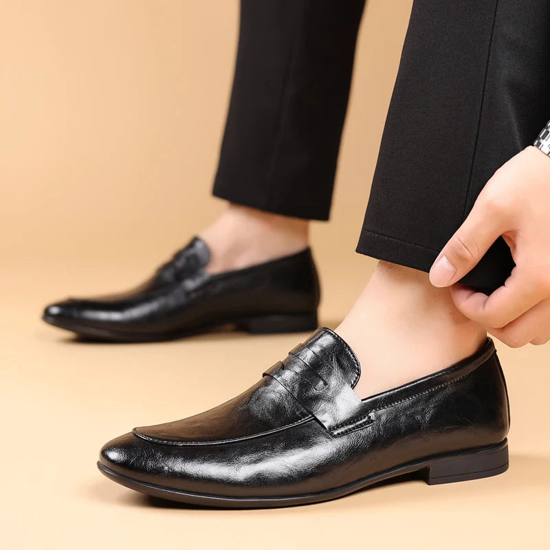High-quality men's black leather slip-on loafers, durable and polished for formal occasions.